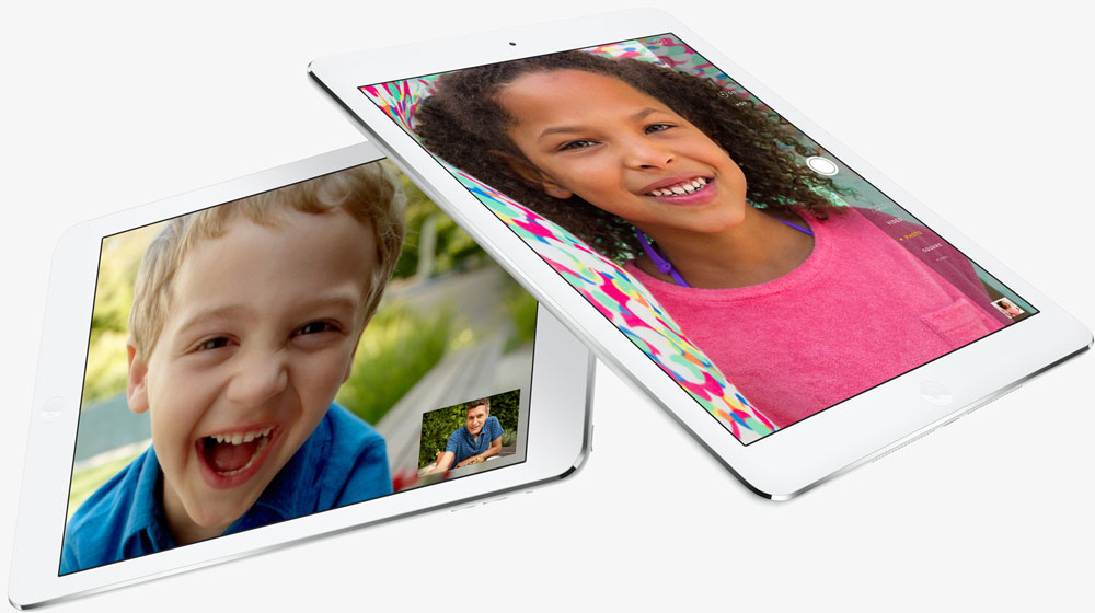  Two iPad Air, with one partially stacking over the other one. Screen of each iPad Air shows interface of video chat.   